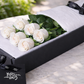 long stemmed white roses in gift box