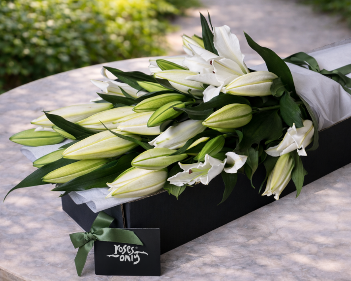white lilies in gift box